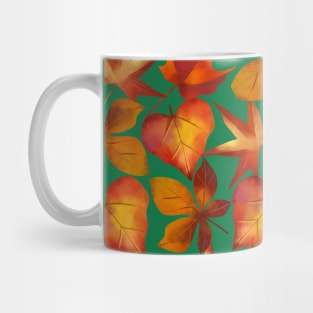 Autumn leaves on green background Mug